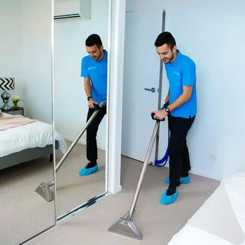 Squeaky clean team member cleaning carpet