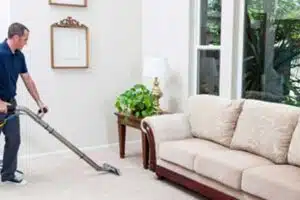A Man is Cleaning Resident Carpet