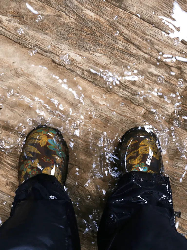 Flooded Feet On Wooden Floor